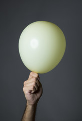 White glove in the background held by a hand