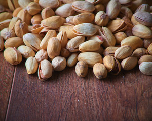 Pistachios over dark background. Food background with copyspace.  Studio photography. Object shooting.