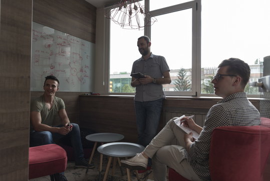 Team Meeting And Brainstorming In Small Private Office