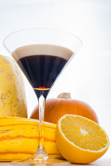 Pumpkin Spice Cocktail On a White Background With Pumpkins And Orange