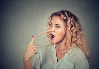 Obraz premium Woman with long nose. Liar concept