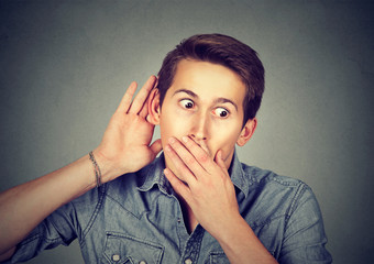 curious young man listening to a conversation