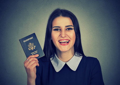 attractive young excited woman with USA passport