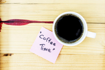 coffee time in pink pos it on wood background