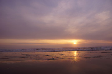 Golden sun setting on the Pacific Ocean