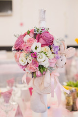 Table in restaurant decorated with flowes