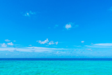 Fototapeta na wymiar White clouds with blue sky over calm sea in tropical Maldives i