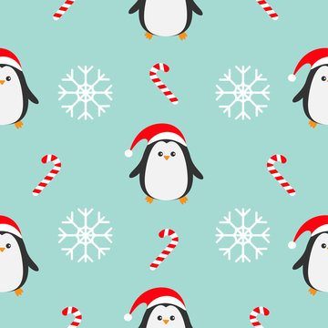 Christmas snowflake candy cane, penguin wearing red santa hat, scarf. Seamless Pattern Decoration. Wrapping paper, textile template. Blue background. Flat design.
