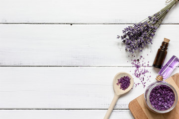 Essential oil and lavender salt with flowers top view