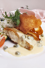 Fish with vegetables and green pea sauce