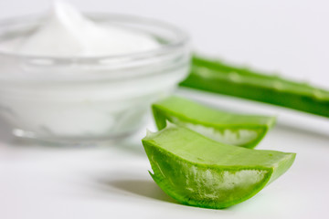 aloe vera - leaves and cream isolated on white background