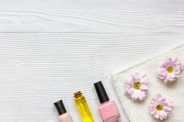 nail polishes and spa on wooden background
