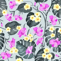 Tropical flowers and jungle palms. Beautiful fabric pattern with a tropical plumeria isolated over gray background. Seamless texture. Vector illustration.