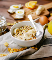 healthy breakfast bowl of yogurt with granola and eggs