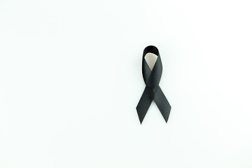 Black ribbon sign use for commemorate dead people,isolate on white background.