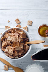 Healthy breakfast - cereal rings in a bowl with milk