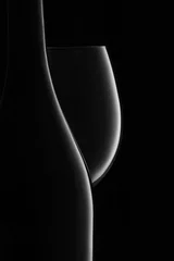 Rolgordijnen Fles en glas witte wijn op een zwarte © ValentinValkov