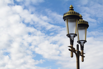 Fototapeta na wymiar Public illumination lights with blue sky