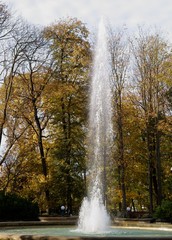 view at fountain and trees in Park in Jaslo at autumn