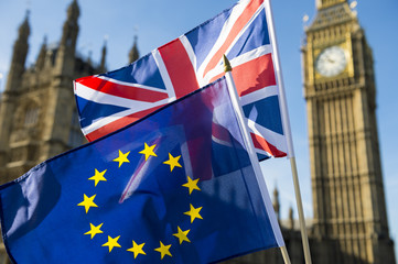 European Union and British Union Jack flag flying in front of Big Ben and the Houses of Parliament at Westminster Palace, London, in symbol of the Brexit EU referendum - obrazy, fototapety, plakaty