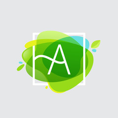 Obraz premium Letter A logo in square frame at green watercolor splash backgro