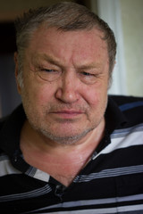 Portrait of a senior man looking to camera, home family