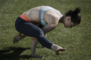 Athletic girl in park during gym session