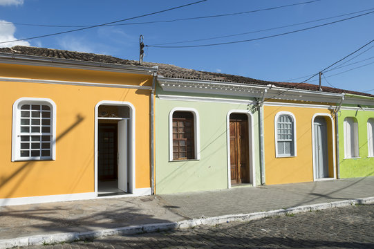 Traditional colorful Brazilian Portuguese colonial architecture on a cobblestone street in Nordeste Bahia Brazil