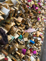 Fototapeta na wymiar Love Padlocks at Pont de l'Archevche in Paris. The thousands of locks of loving couples symbolize love forever.
