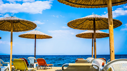 Beautiful Seascape With Sun Umbrellas And Sunbeds, Stavros, Greece