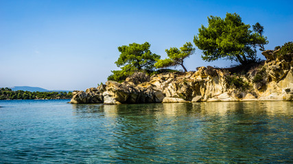 Fototapeta na wymiar Beautiful Small Beach With Turquoise Water And Rocks Around It, Sithonia, Halkidiki, Greece