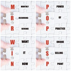 Hand of business man completing the puzzle