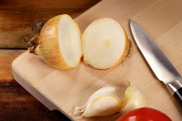 Fresh organic onion on cutting board