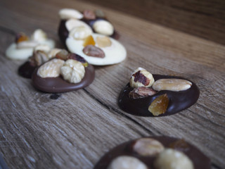 Pieces of black, white and chocolate with milk