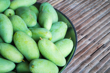 Mango harvest from tree place on bamboo table