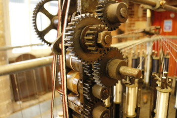 Gears of the machine that winds the bobbins