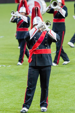 Show band with live music playing wind instruments in uniform