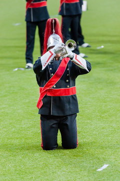 Show band with live music playing wind instruments in uniform