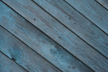 Obraz premium Old wooden painted light blue rustic background, paint peeling