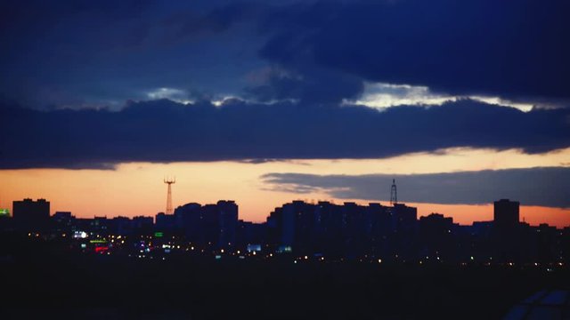 Timelapse of beautiful sunset over silhouette city skyline. 1920x1080