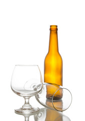 Fototapeta premium Empty beer bottle and glasses,shot on white isolated..