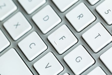 Close up of white wireless aluminum keyboard