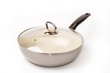 Empty frying ceramic pan on a white background