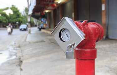 Fototapeta premium Fire hydrant to the left with copy space left. over light [blur and select focus background]