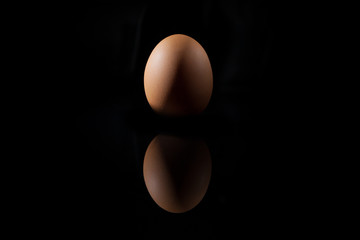 Egg on Black background reflected
