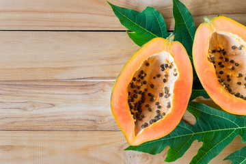 ripe papaya on wood table from above , ripe papaya health benefi