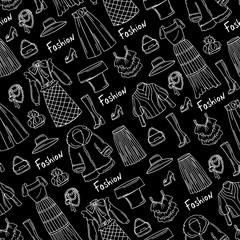 Pattern with hand drawn isolated fashionable clothes for ladies on black color. Pattern on the theme of fashion