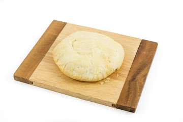 The Taiwanese sun cake (milk butter pastry) on the brown wooden plank.