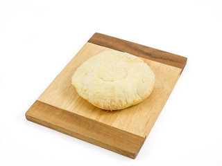 The Taiwanese sun cake (milk butter pastry) on the brown wooden plank.