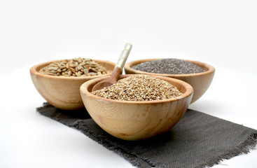 Wooden bowl filled with seeds of Sesame